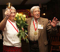Norma Walker '51 and Charlie Contas '42 maintain order--and fun--at the 100th Golden Circle luncheon.