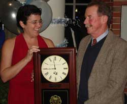 Alumni Board President Sue Fortier '86 presented Past President David Gagne '73 with a handsome KSC wall clock at the Winter Celebration on Jan. 30.