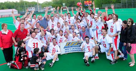 The jubilant LEC Champions on Saturday, May 8. Note junior attackman Cam Sousa holding fallen goalie Alec Corliss' #31 jersey in the lower left. In a remarkable display of camaraderie, Sousa ran back to grab the jersey and make sure his teammate, who contributed so much to the victory and was at that moment on his way to the hospital, had a presence in the historic photo.
