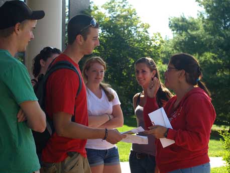 Incoming students learn about the Green Bikes on campus from Peggy Richmond ‘93, Director of Admissions.