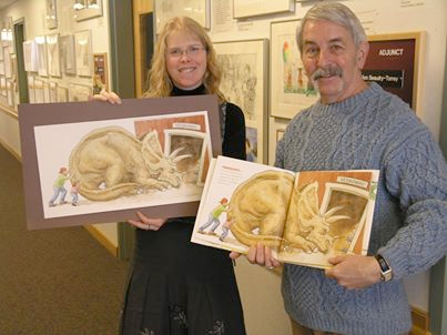 Author and illustrator Lita Judge presenting an illustration from her book How Big Were Dinosaurs? to Festival Gallery founder Dr. David White.