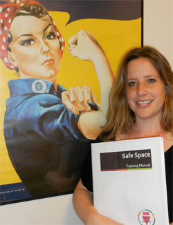 Jamie Landau holding the Safe Space handbook